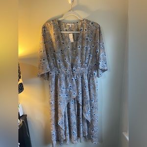 NWT Sheer top, long in the back and short in front.